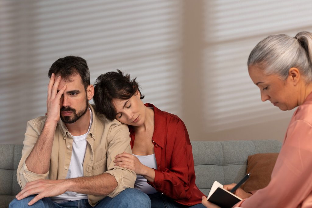 A couple discussing their situation with a professional