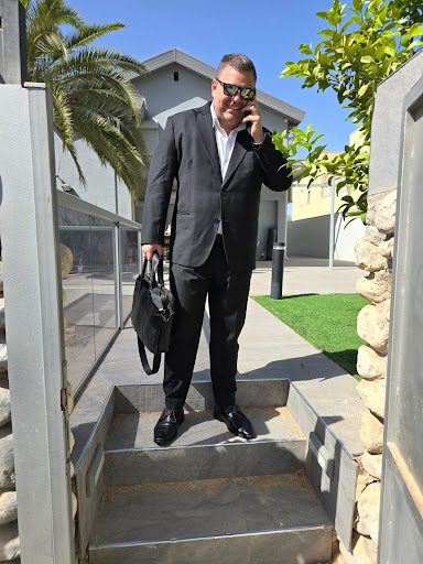 Gabriel Lior, founder of ICBFL, outdoors with a briefcase